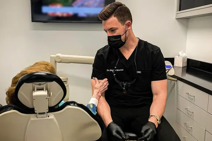 Dr. Morton helping a patient with an emergency | emergency dentist Mt Juliet, TN
